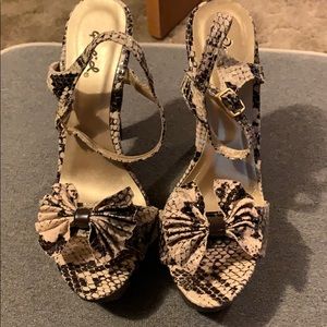 Like New worn only a few times. Qupid Heels